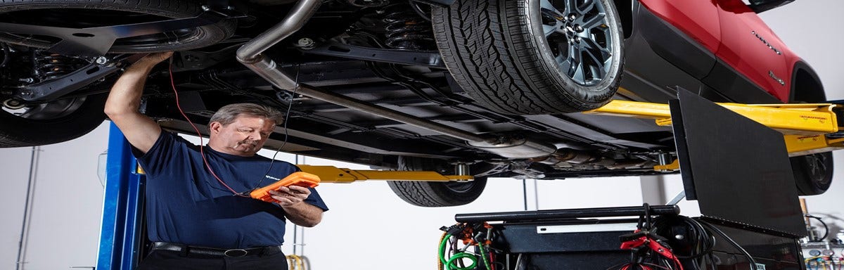 BraunAbility trained technician performing vehicle maintenance