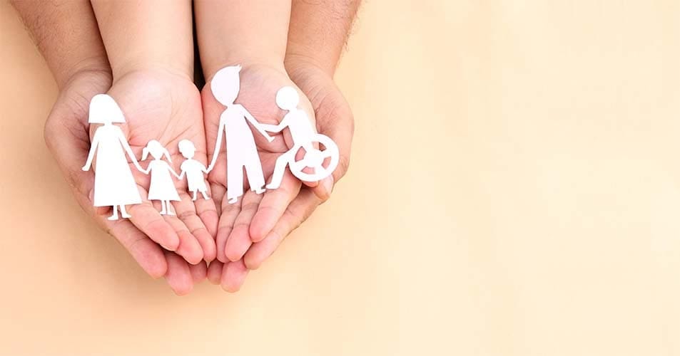 Hands holding a paper cutout