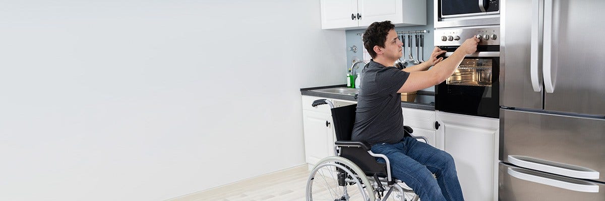 Wheelchair user in kitchen